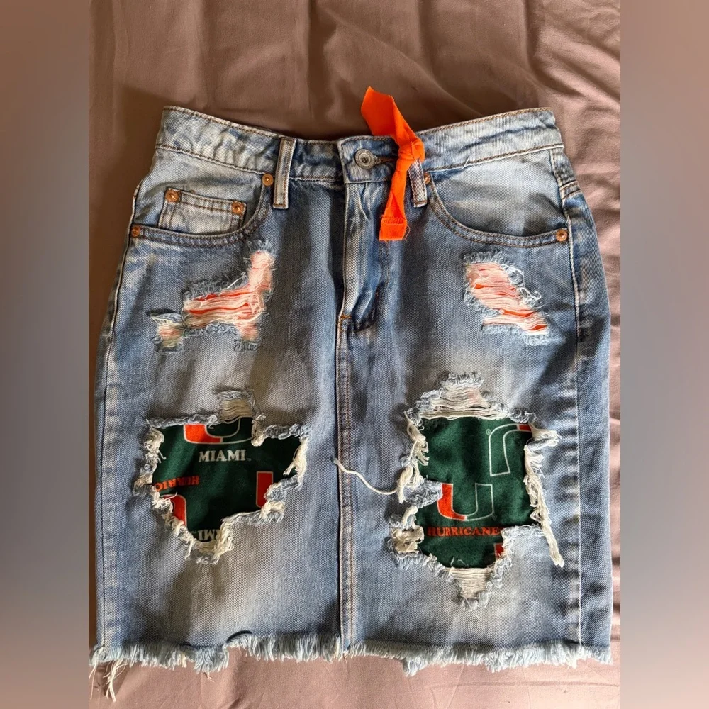 Stylish UM University of Miami Blue Distressed Denim Skirt with Orange Accents - Picture 1 of 3
